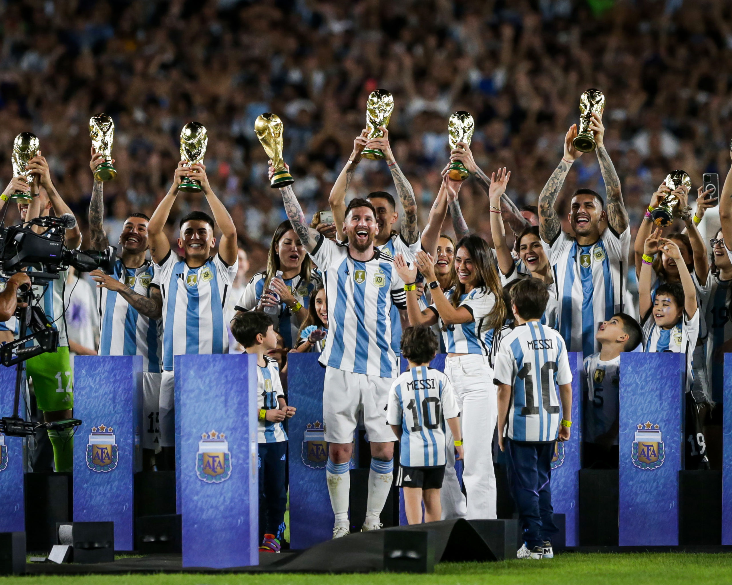 Argentina team lifting their replica trophies - Courtesy Photo