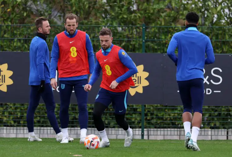 Harry Kane looks on as Jordan Henderson goes about his business - Courtesy Photo