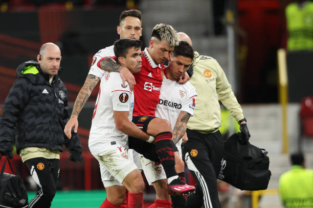 Lisandro Martinez being carried away by Sevilla players - Courtesy Photo