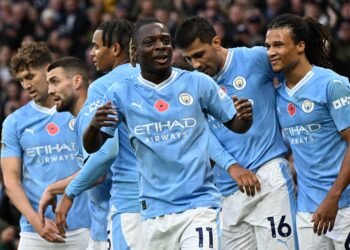Jeremy Doku stars as Man City ease past Bournemouth to go top of the table